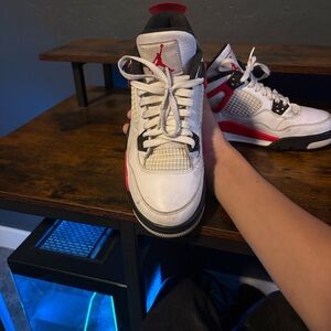 White and Black Sneakers with Red Accents